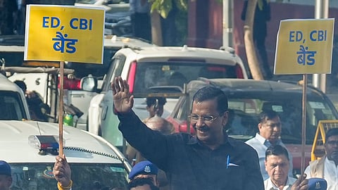 Aam Aadmi Party (AAP) chief and former Delhi chief minister Arvind Kejriwal greets supporters during a roadshow after he along with his deputy Manish Sisodia and 21 others were discharged by a Delhi court in the liquor policy case, in New Delhi, Friday, Feb. 27, 2026