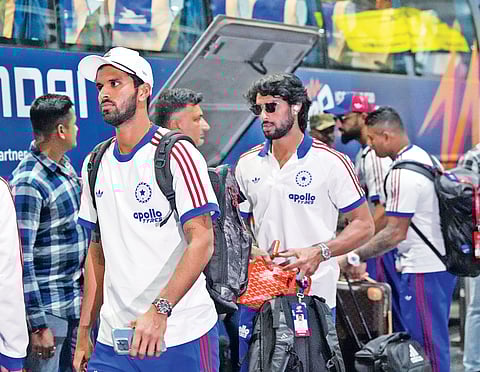 Washington Sundar and Tilak Varma leave the airport after the team's arrival in Kolkata on Friday