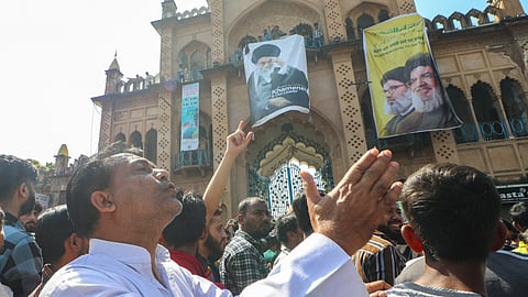 People from the Muslim community shout slogans during a protest against the alleged killing of Iranian Supreme Leader Ayatollah Ali Khamenei in a reported US-Israel strike, near Bara Imambara, in Lucknow
