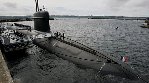 French Marine officers wait atop "Le Vigilant" nuclear submarine at L'lle Longue military base, near Brest, Brittany.