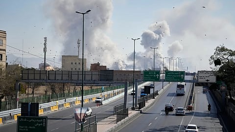 Plumes of smoke rise as strikes hit the city during the U.S.–Israeli military campaign in Tehran, Iran