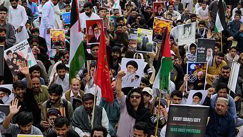 Shiite Muslims take part in a rally to condemn the killing of Iranian Supreme Leader Ayatollah Ali Khamenei and against the Israeli strikes on Iran, in Islamabad, Pakistan, Friday, March 6, 2026