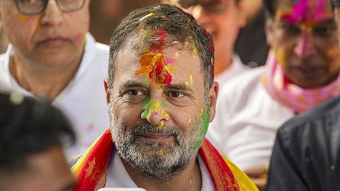 Congress leader and Leader of Opposition in the Lok Sabha Rahul Gandhi during the Holi festival celebration at the party office, in New Delhi.