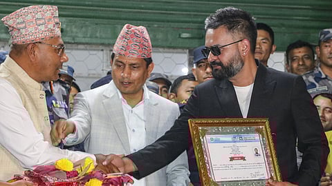 Balendra Shah, right, prime ministerial candidate of the Rastriya Swatantra Party (RSP) from Jhapa Constituency-5, at the Election Commission premises after winning the constituency in the Nepal general elections, in Jhapa, Nepal