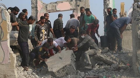 Rescue workers and residents search through the rubble in the aftermath of what Iranian officials said was an Israeli-U.S. strike on a girls' elementary school in Minab, Iran