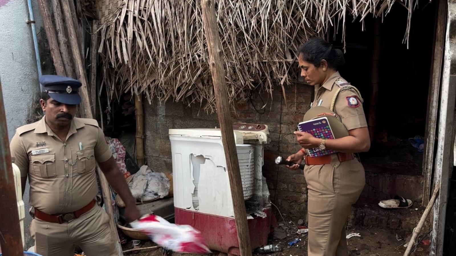 Police collecting evidence at the murder site 