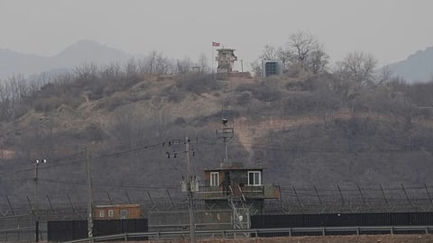 A North Korean military guard post, top, and a South Korean post, bottom, are seen from Paju, South Korea, near the border with North Korea.