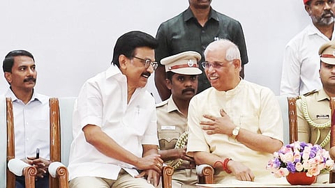 Chief Minister MK Stalin, Governor-in-charge Rajendra Vishwanath Arlekar sharing a lighter moment at the swearing-in ceremony at Lok Bhavan on Thursday