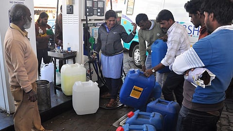 People queued up to buy fuel in cans in the Nilgiris