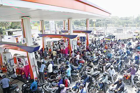 People throng a fuel station at Velachery on Thursday