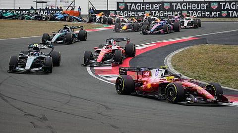 Ferrari driver Lewis Hamilton of Britain steers his car ahead of others during the Chinese Formula One Grand Prix race at the Shanghai International Circuit, in Shanghai, China