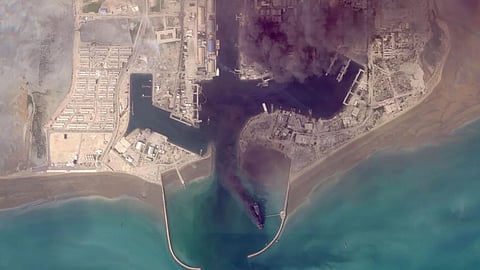 This satellite image from Planet Labs PBC shows fires burning on ships after a U.S. military attack on a port in Bandar Abbas, Iran