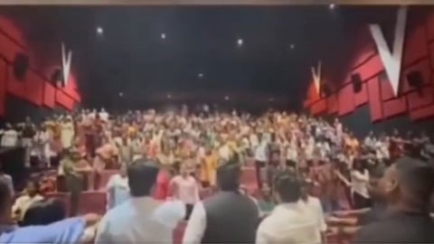 Crowd in cinema hall pledging to boycott Muslims