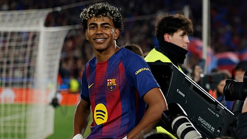 Barcelona's Lamine Yamal celebrates after scoring a penalty, his side's third goal during the Champions League round of 16, second leg soccer match between FC Barcelona and Newcastle United FC in Barcelona, Spain