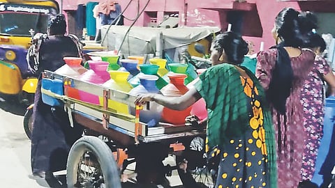 Women from Mallipoo Colony 2nd lane collect water from neighbouring streets using cart puller
