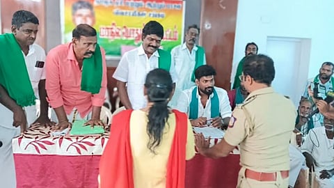 Poll officials talking to office-bearers of the farmers' association in Tiruchy on March 26