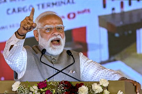 Prime Minister Narendra Modi addresses a gathering during inauguration of the newly constructed Noida International Airport, in Noida, Uttar Pradesh.