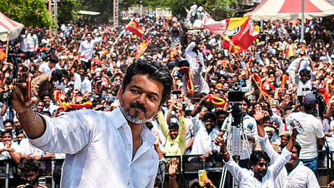 TVK chief actor Vijay snapping a selfie with supporters and cadre in Perambur on Monday
