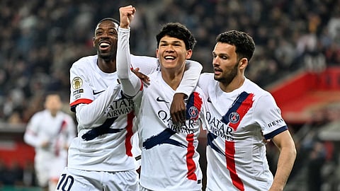 PSG's Pedro Fernandez, center, celebrates after scoring his side's third goal during the French League One soccer match between Nice and Paris Saint-Germain in Nice, France, Saturday, March 21, 2026. 