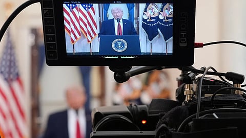 President Donald Trump speaks about the Iran war from the Cross Hall of the White House in Washington.