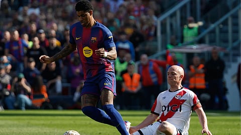Barcelona's Marcus Rashford in action in front of Rayo's Isi Palazon during a La Liga soccer match between Barcelona and Rayo Vallecano in Barcelona, Spain, Sunday, March 22, 2026.