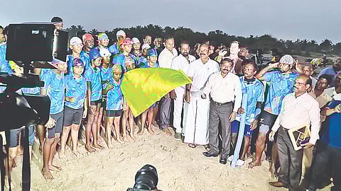 The organisers, coach, and the austistic children from one of the previous swimming events 