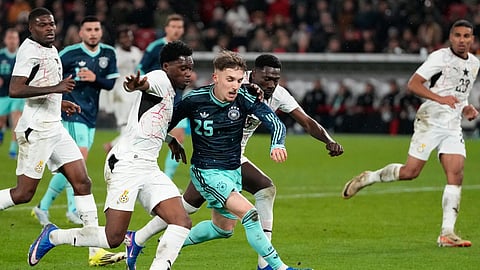 Lennart Karl of Germany and Derrick Kohn of Ghana challenge for the ball during an international friendly soccer match between Germany and Ghana in Stuttgart, Germany, Monday, March 30, 2026. 