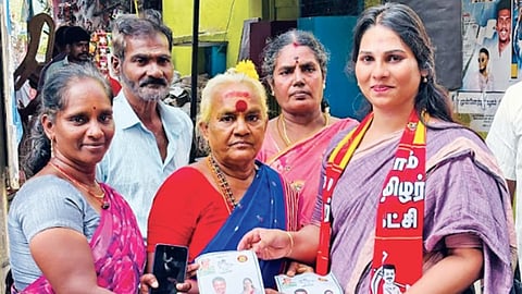 NTK candidate in Villivakkam, Roshini, distributing party
pamphlets to voters in the city on Monday