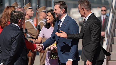 Hungarian Foreign Minister Peter Szijjarto, right, welcomes U.S. Vice President JD Vance, center right, and second lady Usha Vance, center left, as they arrive at Budapest Ferenc Liszt International Airport in Budapest, Hungary 