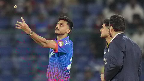 Delhi Capitals' captain Axar Patel, left, flips the coin at the toss as Gujarat Titans' captain Shubman Gill looks on ahead of an Indian Premier League (IPL) 2026 T20 cricket match between Delhi Capitals and Gujarat Titans, at Arun Jaitley Stadium, in New Delhi, Wednesday, April 8, 2026 