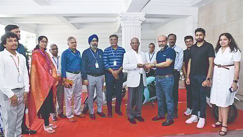 Dignitaries from SRMIST and Ather Energy during the handover of three electric vehicles