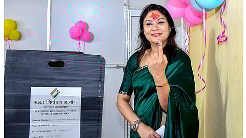 Assam Chief Minister Himanta Biswa Sarma's wife Riniki Bhuyan Sarma shows her inked finger after casting vote in the Assam Legislative Assembly election, at a polling station, in Guwahati, Thursday, April 9, 2026 