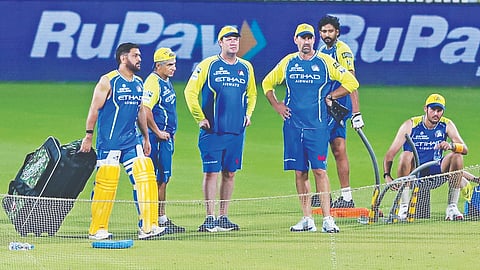 MS Dhoni and head coach Stephen Fleming attend a training session