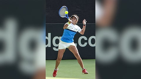 India's Ankita Raina returns a shot during a Billie Jean King Cup Asia/Oceania Group I women's singles match against South Korea's Dayeon Back, in New Delhi