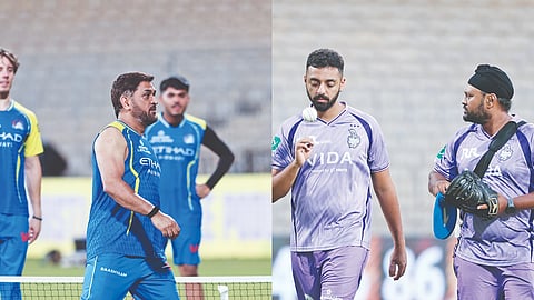 MS Dhoni at a training session and KKR’s Varun Chakravarthy gets ready to bowl in the