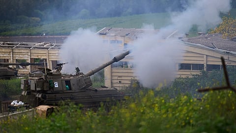 Israeli military mobile artillery unit fires towards southern Lebanon from northern Israel