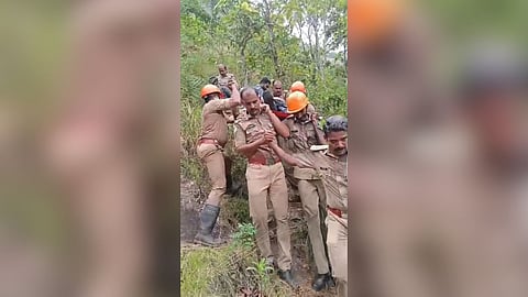 Fire personnel rescuing the diff-abled youth after he fell into a gorge
