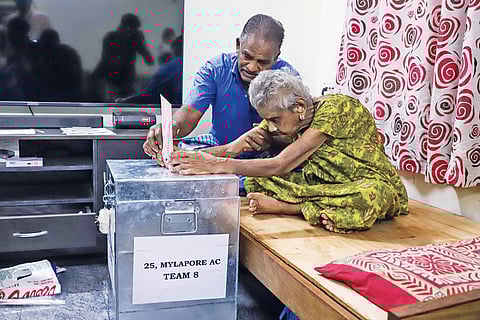 An 86-year-old woman from Mylapore exercising her franchise on Thursday after
postal voting for elderly people commenced in Chennai. The Election Commission has made the arrangement for voters aged 85 and above