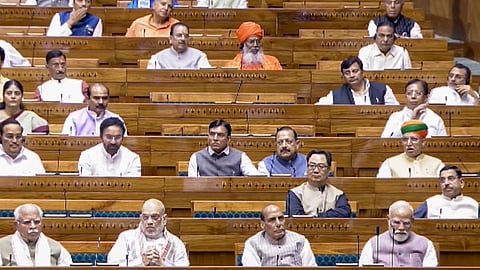 Prime Minister Narendra Modi, Union Home Minister Amit Shah, Defence Minister Rajnath Singh, and other members in the Lok Sabha during the Special session of Parliament, in New Delhi, Saturday, April 18, 2026