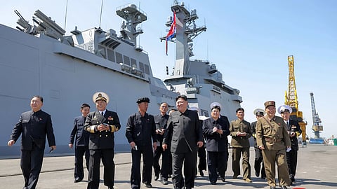 In this photo provided by the North Korean government, its leader Kim Jong Un, center, visits to observe the test launches of missiles at an undisclosed place in North Korea Sunday, April 12, 2026.