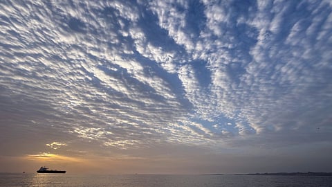 The sun rises behind a tanker anchored in the Strait of Hormuz off the coast of Qeshm Island, Iran.