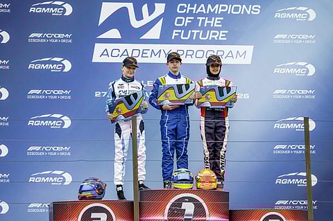 Indian racer Atiqa Mir, right, poses on the podium after finishing third in the final of Round 1 of the Champions of the Future Academy karting series at the Lucas Guerrero Circuit, in Valencia, Spain. 