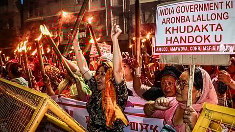 Protesters clash with police during torch rally