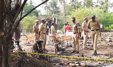 Forensic officials conduct a search operation after a blast at a fireworks manufacturing unit on Tuesday night, at Mundathicode in central Kerala's Thrissur district