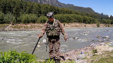  Pahalgam: A security personnel carries out checking operations on the first anniversary of the Pahalgam terror attack, in which 26 men were gunned down by Lashkar-e-Taiba terrorists last year, at Pahalgam in Anantnag district, Jammu and Kashmir, Wednesday, April 22, 2026.