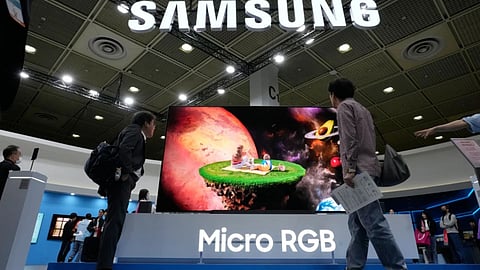Visitors watch a Samsung Electronics’ Micro RGB TV at its booth during the World IT Show in Seoul, South Korea, Wednesday, April 22, 2026.