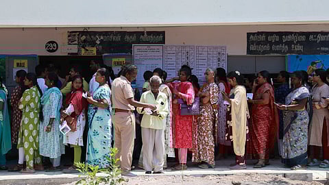 People were standing in a queue to cast their votes.