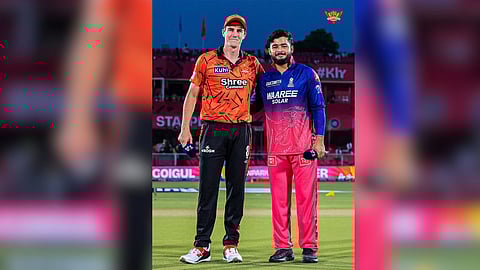 Sunrisers Hyderabad captain Pat Cummins with Rajasthan Royals skipper Riyan Parag during the toss.