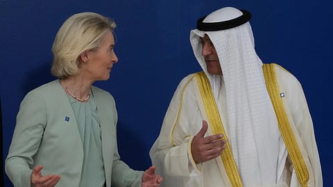 European Commission President Ursula von der Leyen, left, speaks with the Gulf Cooperation Council Secretary General Jasem Mohamed Albudaiwi before a family photo of the EU Summit in Nicosia