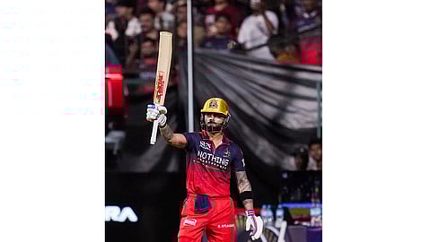 Royal Challengers Bengaluru's Virat Kohli greets fans as he returns to the pavilion after his dismissal by Gujarat Titans' Jason Holder during an Indian Premier League (IPL) 2026 T20 cricket match between Royal Challengers Bengaluru and Gujarat Titans, in Bengaluru, Karnataka, Friday, April 24, 2026 